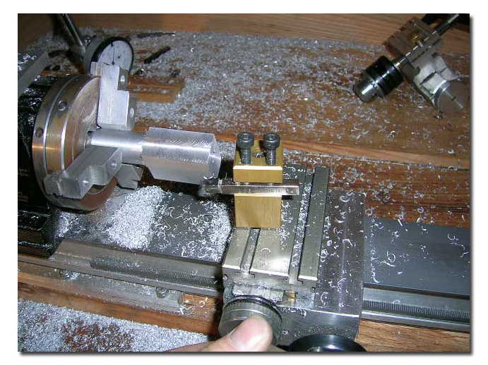 Squaring the bracket end of the barrel on the lathe.